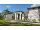 Inviting home facade with elegant black-framed windows and landscaped front yard at 18721 Seaview St, Orlando, FL 32833