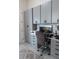 Comfortable home office with built-in cabinets, drawers and gray countertops at 18721 Seaview St, Orlando, FL 32833