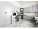 Well-organized home office with custom gray cabinets, workspace and a comfortable chair at 18721 Seaview St, Orlando, FL 32833