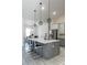 This kitchen features an island with pendant lighting, stainless steel appliances, and barstool seating, perfect for entertaining at 18721 Seaview St, Orlando, FL 32833