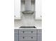 This kitchen showcases modern appliances, a stainless steel range hood, and a sophisticated backsplash design, enhancing its appeal at 18721 Seaview St, Orlando, FL 32833