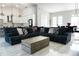 Open concept living room with tile floors and a large sectional sofa at 18721 Seaview St, Orlando, FL 32833