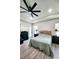Comfortable main bedroom featuring a ceiling fan, wood-look floors, and a door to the pool area at 18721 Seaview St, Orlando, FL 32833