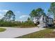 Long driveway with space for RV parking on a sunny day at 18721 Seaview St, Orlando, FL 32833