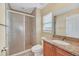 Bathroom featuring tiled shower, toilet, vanity with granite countertop and sink at 2311 Whitley Ln, Winter Haven, FL 33881