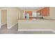 Modern kitchen with stainless steel appliances, granite countertops, and ample cabinet space at 2311 Whitley Ln, Winter Haven, FL 33881