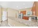 Modern kitchen with stainless steel appliances, granite countertops, and ample cabinet space at 2311 Whitley Ln, Winter Haven, FL 33881