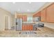 Modern kitchen with stainless steel appliances, granite countertops, and ample cabinet space at 2311 Whitley Ln, Winter Haven, FL 33881