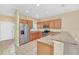 Modern kitchen with stainless steel appliances, granite countertops, and ample cabinet space at 2311 Whitley Ln, Winter Haven, FL 33881