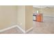 Open-concept kitchen featuring stainless steel appliances, tile floors, and a breakfast bar at 2311 Whitley Ln, Winter Haven, FL 33881
