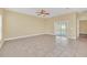 Spacious living room featuring neutral walls and sliding glass doors at 2311 Whitley Ln, Winter Haven, FL 33881