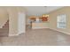 Living and Dining space offers a spacious layout with kitchen access and staircase at 2311 Whitley Ln, Winter Haven, FL 33881