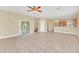 The spacious living room features neutral walls and easy access to the kitchen at 2311 Whitley Ln, Winter Haven, FL 33881