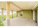 Relaxing covered patio area perfect for entertaining or enjoying the outdoors with a nice grassy view at 2311 Whitley Ln, Winter Haven, FL 33881