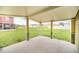 Covered patio featuring decorative column pedestals overlooking a grassy yard at 2311 Whitley Ln, Winter Haven, FL 33881