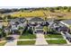 Aerial view of a charming community with well-manicured lawns and solar panels at 3029 High Pointe St, Clermont, FL 34711