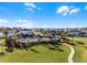 Aerial image of community pool and playground amidst a backdrop of beautiful landscaping and homes at 3029 High Pointe St, Clermont, FL 34711