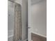 Neutral bathroom with a tub and shower, as well as a view into the next room at 3029 High Pointe St, Clermont, FL 34711