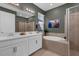 Elegant bathroom featuring a double vanity, soaking tub, and a separate glass shower at 3029 High Pointe St, Clermont, FL 34711