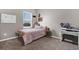 Cozy bedroom with a comfortable bed, lots of natural light, and calming gray walls at 3029 High Pointe St, Clermont, FL 34711