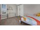 Neutral-toned bedroom with natural light from the window and ample space at 3029 High Pointe St, Clermont, FL 34711