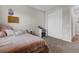 Bedroom with a bed, a dressing table and chair, and a closet with sliding doors at 3029 High Pointe St, Clermont, FL 34711