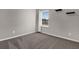 Comfortable bedroom with a window, neutral-toned walls and carpet at 3029 High Pointe St, Clermont, FL 34711