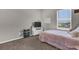 Bedroom with plush carpet, light gray walls, and a large window for natural light at 3029 High Pointe St, Clermont, FL 34711