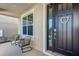 Inviting front porch featuring comfortable seating and a welcoming front door at 3029 High Pointe St, Clermont, FL 34711