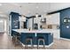 Modern kitchen featuring a large island, stainless steel appliances, and ample counter space at 3029 High Pointe St, Clermont, FL 34711
