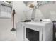 Modern laundry room featuring front-load washer and dryer with shelving at 3029 High Pointe St, Clermont, FL 34711