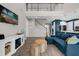 Cozy living room showcasing a modern fireplace and staircase to the second floor at 3029 High Pointe St, Clermont, FL 34711