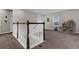 Light and airy loft area with a staircase, a window with blinds, and neutral decor at 3029 High Pointe St, Clermont, FL 34711