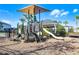 Well-maintained community playground with slides, climbing structures, and shaded seating at 3029 High Pointe St, Clermont, FL 34711
