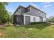 Backyard view showcases the screened patio and the home's exterior at 3173 Riverboat Way, Oviedo, FL 32765