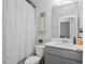 Bathroom featuring vanity sink, with shower and toilet visible behind the curtain at 3173 Riverboat Way, Oviedo, FL 32765