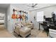 Bedroom featuring a sofa, workspace, and multiple guitars on display at 3173 Riverboat Way, Oviedo, FL 32765