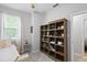 Bedroom featuring bookshelf and window at 3173 Riverboat Way, Oviedo, FL 32765