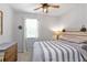 Cozy bedroom with a window and wooden headboard at 3173 Riverboat Way, Oviedo, FL 32765