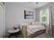 Bright bedroom with a daybed, side tables, and art on the wall at 3173 Riverboat Way, Oviedo, FL 32765