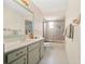 Bathroom with single sink vanity, shower with glass doors, and matching toilet at 320 Isabella Dr, Longwood, FL 32750