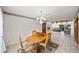 Inviting dining area with tile floors, open to the living room with a stone fireplace, and comfortable seating at 320 Isabella Dr, Longwood, FL 32750