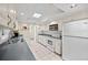 Bright kitchen features white appliances, skylight, and plenty of cabinets and counter space at 320 Isabella Dr, Longwood, FL 32750