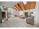 Unique living space featuring a stone fireplace, exposed wood beams, and a spiral staircase at 320 Isabella Dr, Longwood, FL 32750