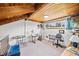 Spacious loft area with wood beamed ceiling, bright lighting and functional work space at 320 Isabella Dr, Longwood, FL 32750