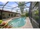 Backyard featuring a screened-in pool and covered patio at 320 Isabella Dr, Longwood, FL 32750