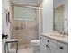 Updated bathroom boasts a glass-enclosed shower and vanity with drawers at 3340 Fernlake Pl, Longwood, FL 32779