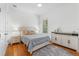 Cozy bedroom with hardwood floors, a comfortable bed, and ample natural light at 3340 Fernlake Pl, Longwood, FL 32779