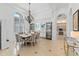 Formal dining room showcasing a chandelier, large arched window with shutters, and stylish decor at 3340 Fernlake Pl, Longwood, FL 32779