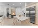 Spacious kitchen features custom cabinets, marble countertops, stainless appliances, and tile floors at 3340 Fernlake Pl, Longwood, FL 32779
